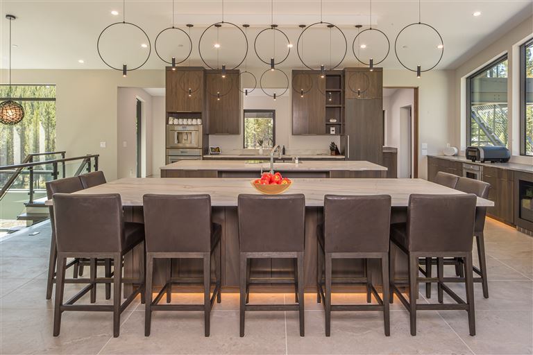 Luxurious contemporary dining room with elegant furniture and natural lighting.