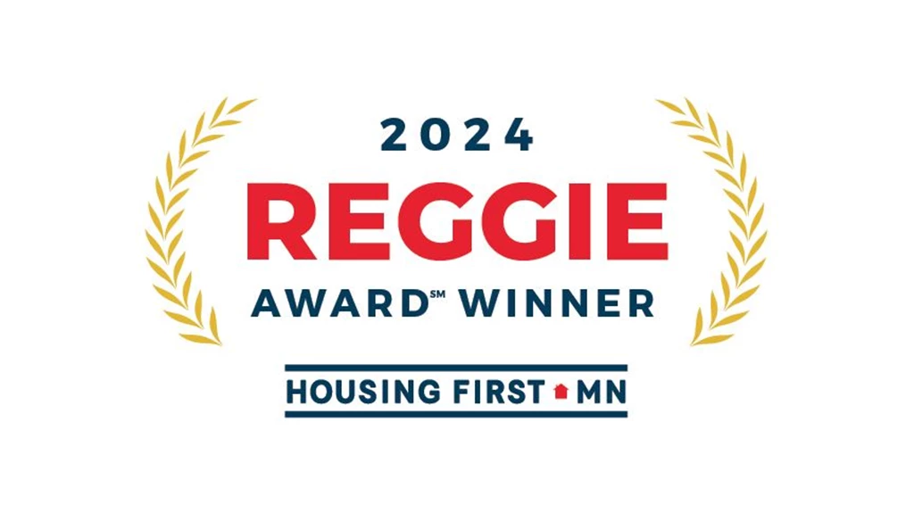 Badge reading '2024 Reggie Award Winner Housing First MN'.