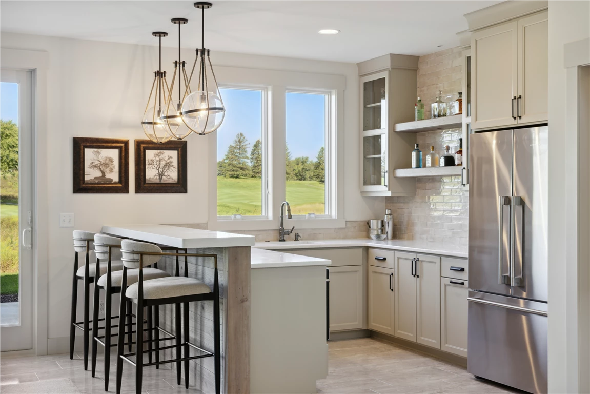 Contemporary kitchen interior with modern appliances and furniture.