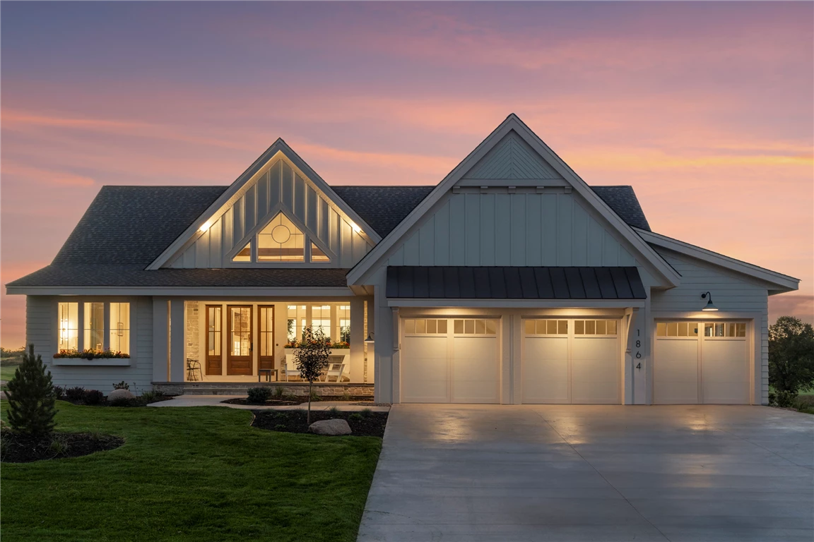 Exterior view of a luxury suburban home with a spacious driveway.