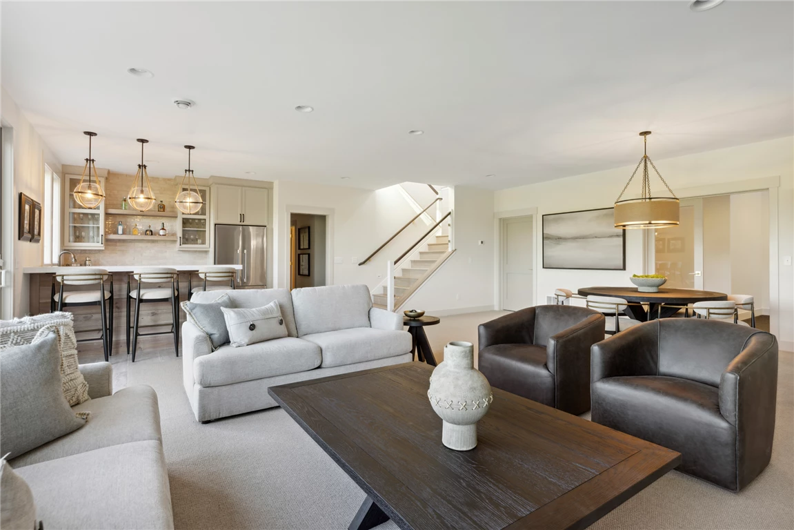 Contemporary family room with luxury furniture and minimalist design.