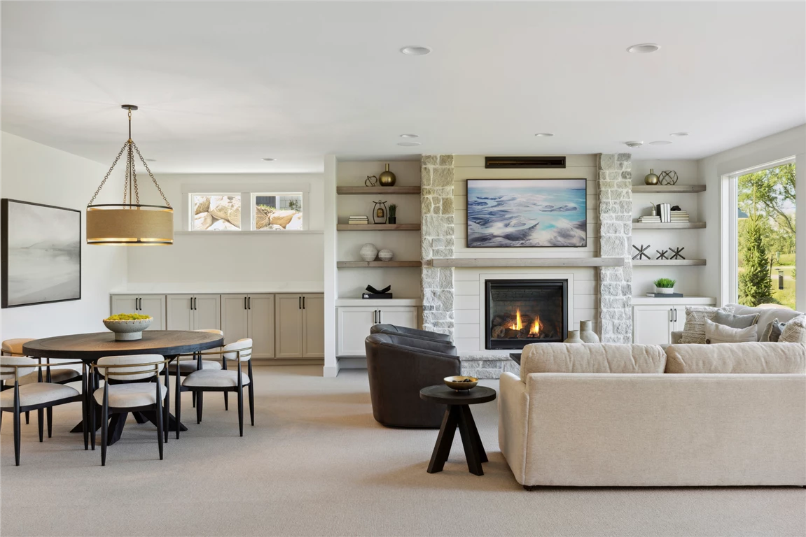 Contemporary family room with sofa, coffee table, and fireplace.