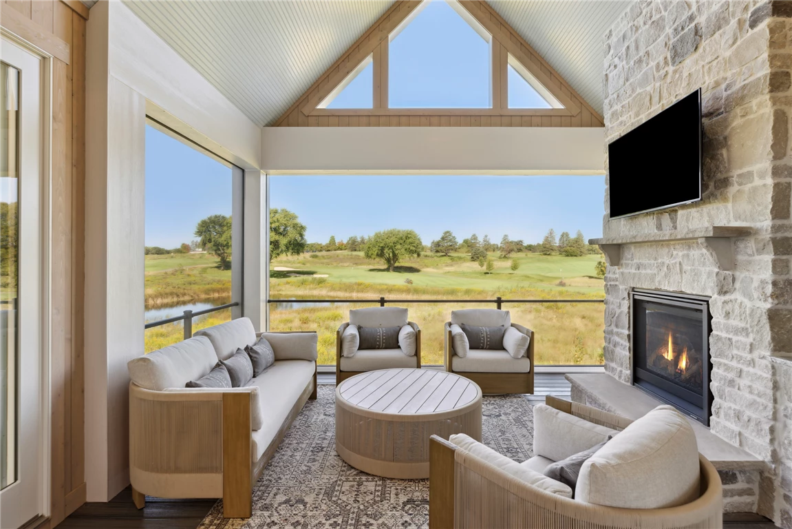 Luxury four-season porch with contemporary furniture and large windows.