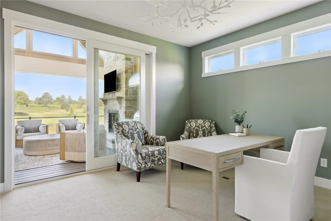 Minimalist home office with contemporary furniture and large window.