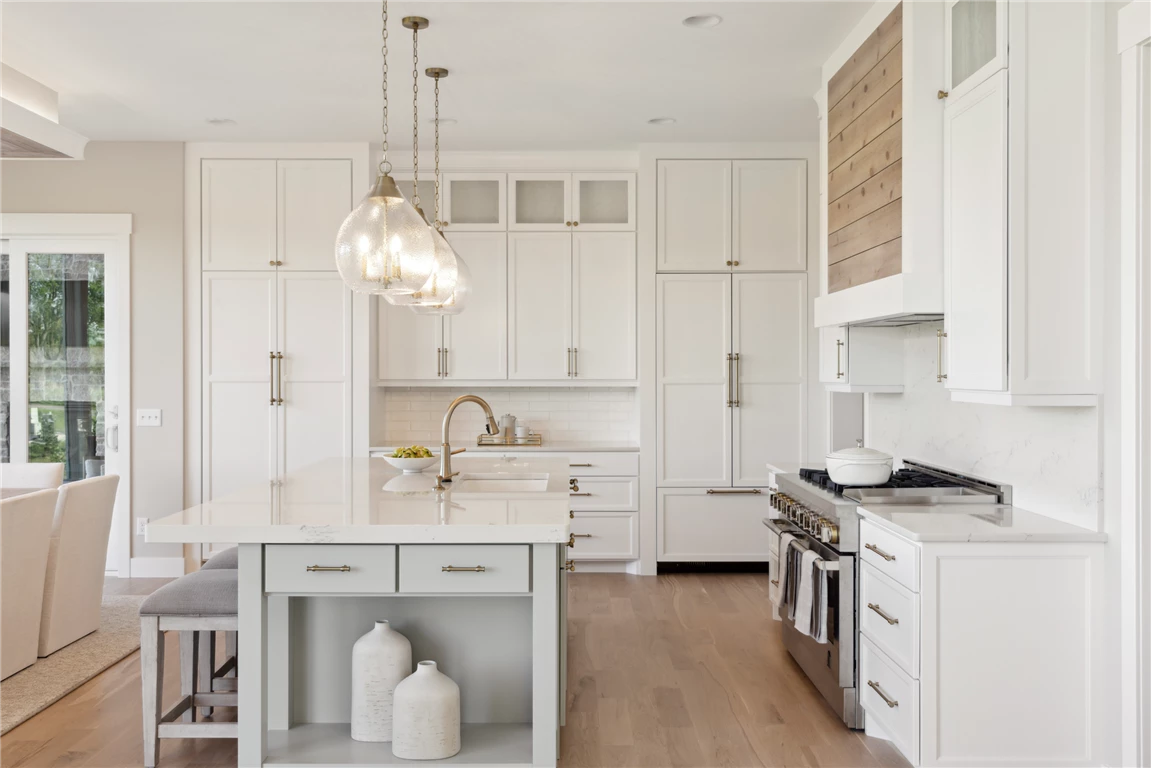 Contemporary minimalist kitchen interior with modern furniture and appliances.