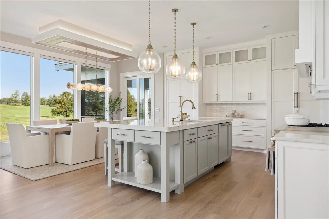 Interior view of a contemporary kitchen and dining room with modern furniture and minimalist design.