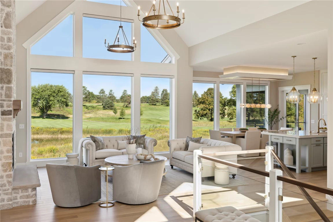 Contemporary minimalist dining room with large windows and elegant furniture.