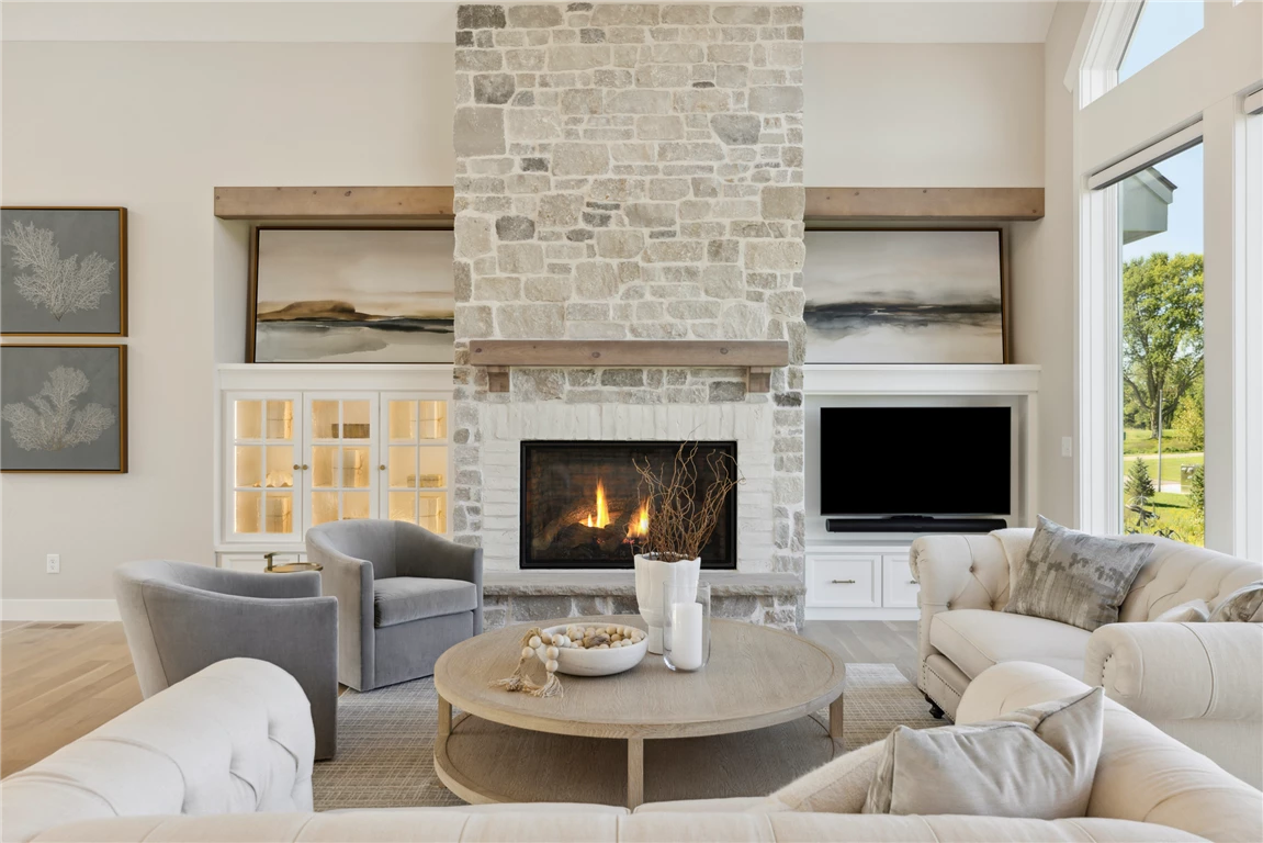 Contemporary living room with fireplace and minimalist decor.