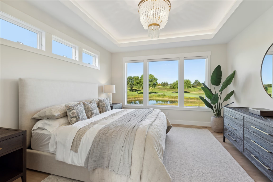 Contemporary master bedroom with minimalist design and luxury furnishings.