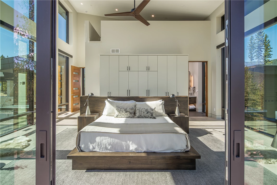 Luxurious contemporary bedroom with modern furniture and decor.