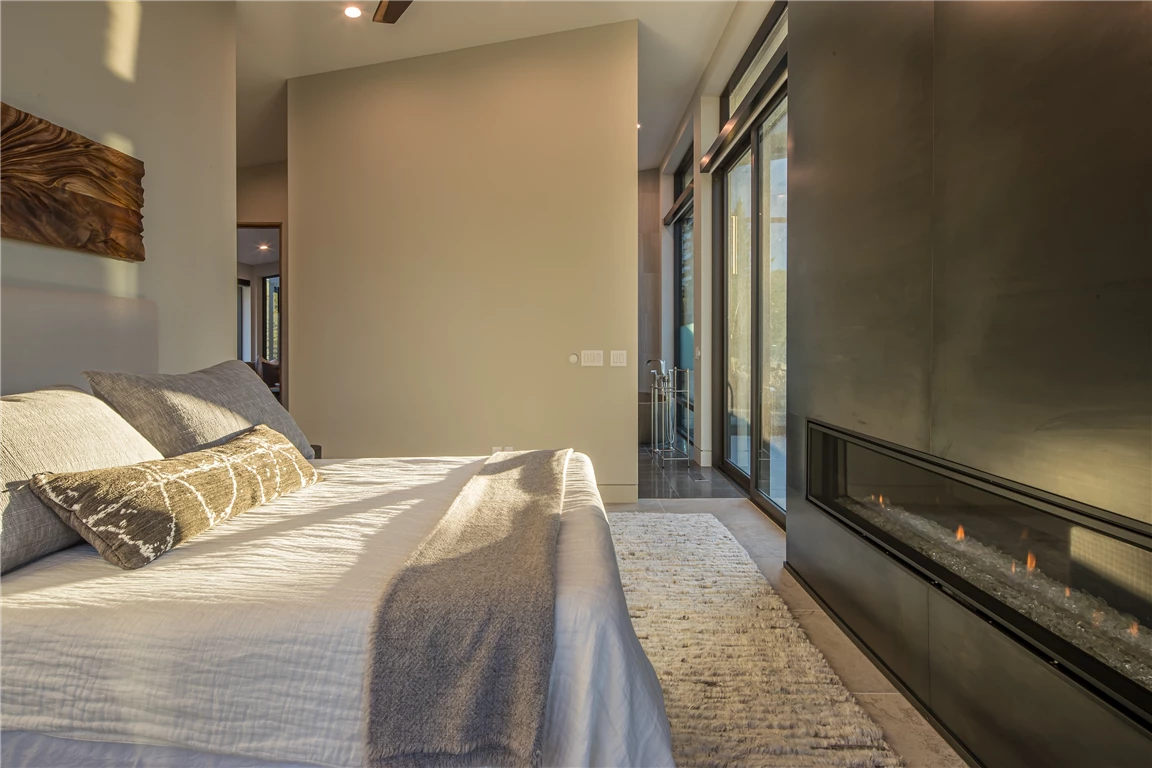 Contemporary luxury hotel bedroom with modern furniture and minimalist decor.