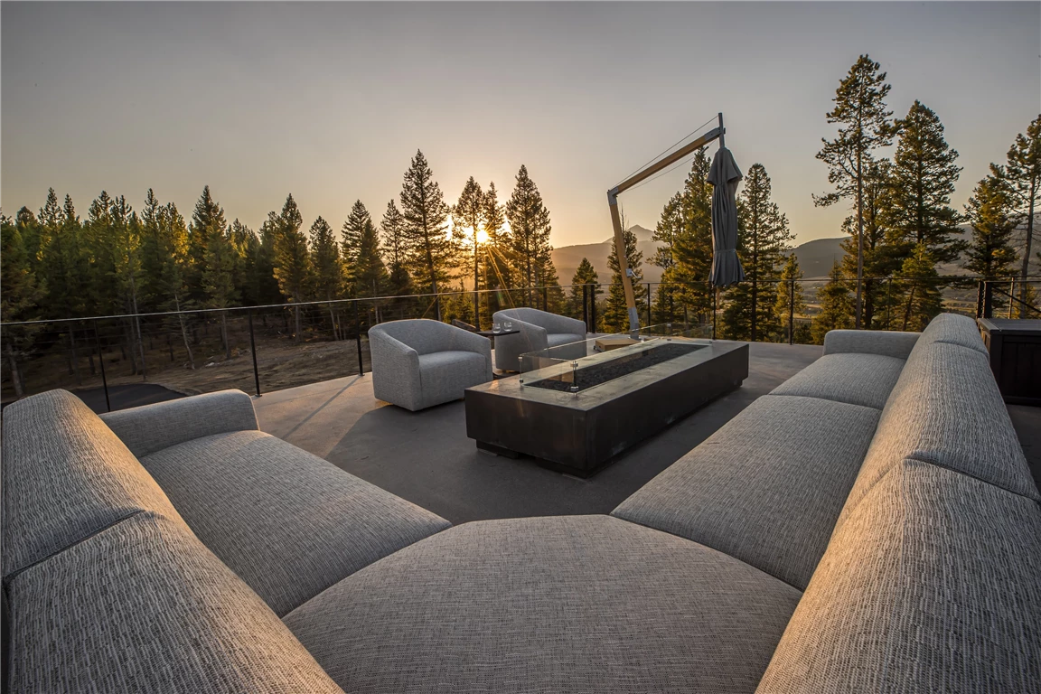 Luxury modern interior with a view of snow-covered trees outside.