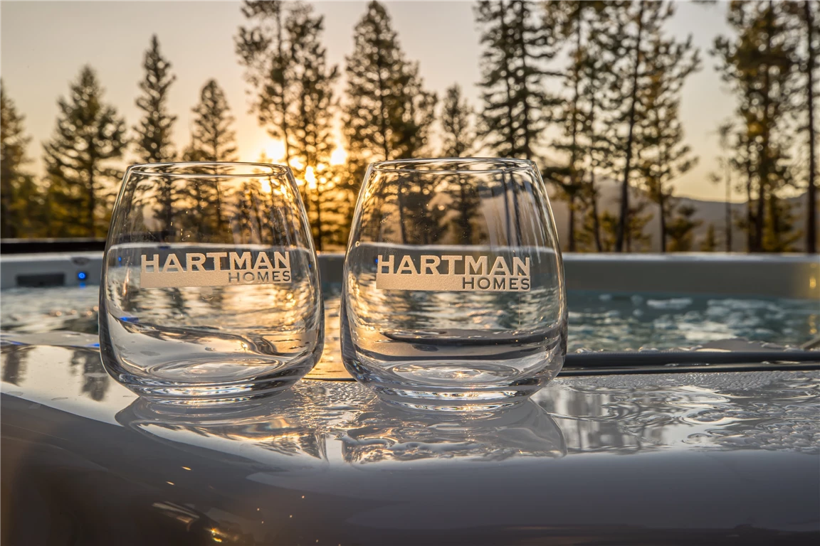 Glasses reflecting a winter sunset, associated with Hartman Homes.