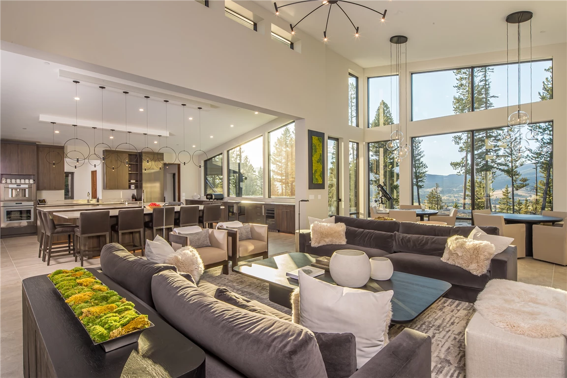 Luxury contemporary living room with sofa, coffee table, and fireplace.